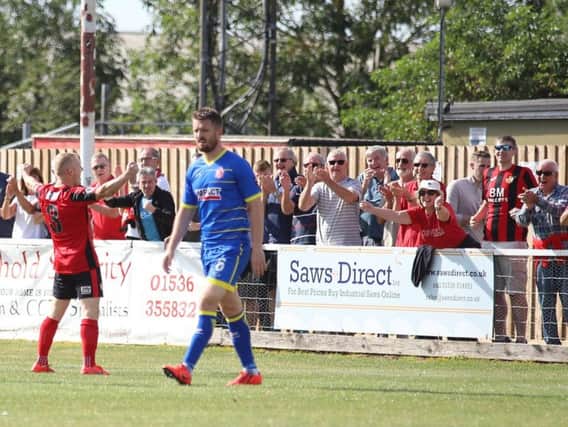 Marcus Kelly celebrates in front of the Kettering Town fans after he scored their second goal in the 2-1 win over Alfreton Town. Pictures by Peter Short