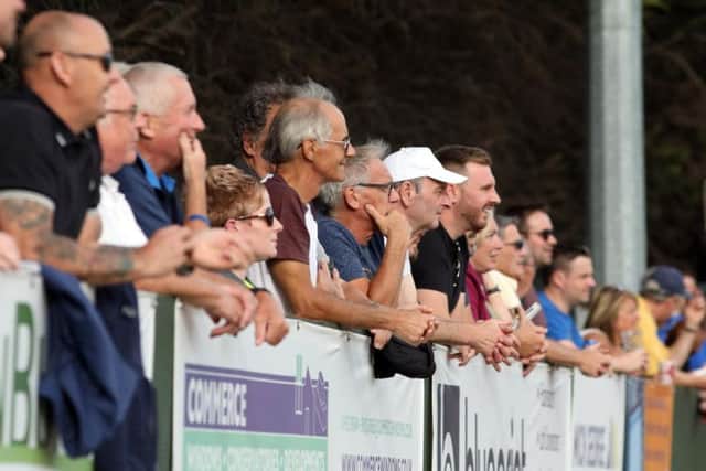 Fans watch on during the game at Hayden Road