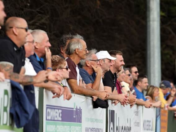 Fans watch on during the game at Hayden Road