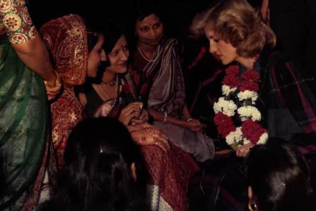 Members of the community showed Princess Diana the art of henna hand decoration