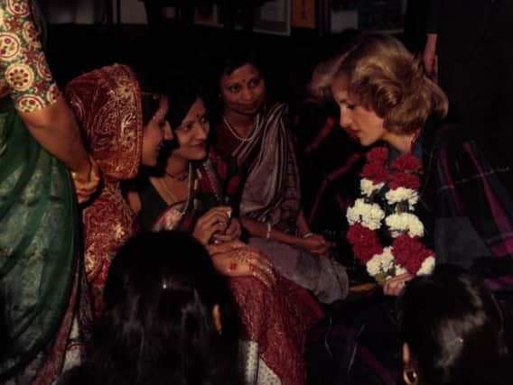 Members of the community showed Princess Diana the art of henna hand decoration
