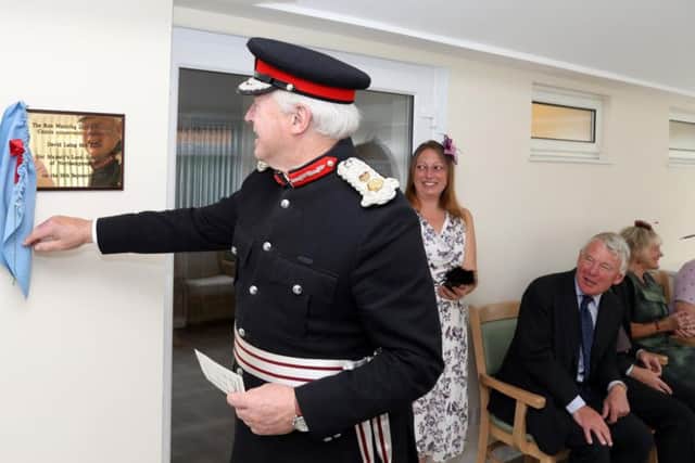 Lord Lieutenant reveals the commemorative plaque marking the opening of the conservatory