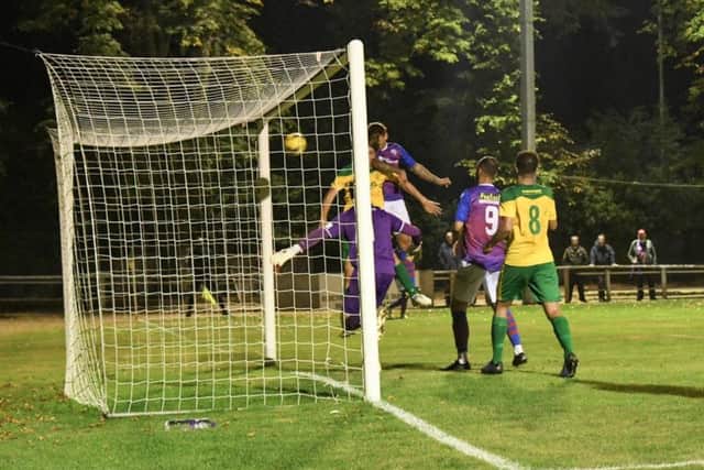 Jack Ashton heads home AFC Rushden & Diamonds' goal in their 1-1 draw at Hitchin Town last night. Pictures courtesy of HawkinsImages
