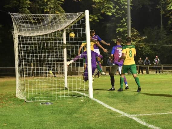 Jack Ashton heads home AFC Rushden & Diamonds' goal in their 1-1 draw at Hitchin Town last night. Pictures courtesy of HawkinsImages