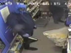 The man seen holding the weapons.