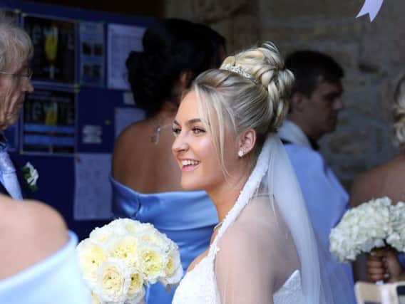 Our Charley. The beaming bride looked happy and relaxed as she entered the church