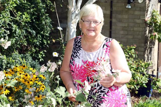 Elaine enjoys spending time in her garden.