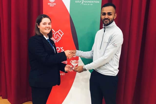 Gracie receives her Hero's Handshake award from Young Ambassador Ali Jodiyawalla