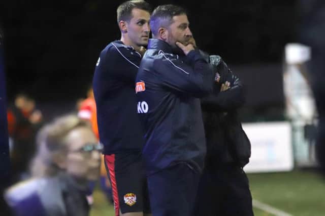 Nicky Eaden and Luke Graham watch on from the sidelines during what proved to be the formers final game in charge of Kettering Town as they slumped to a 2-1 FA Cup replay defeat at Sutton Coldfield Town. Picture by Peter Short
