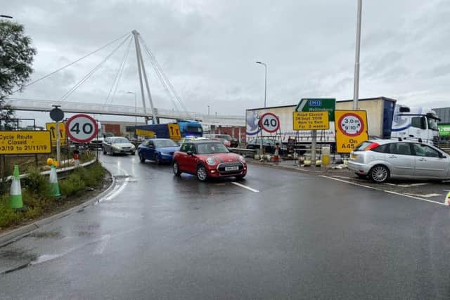 Police are trying to turn around vehicles stuck in the road closure