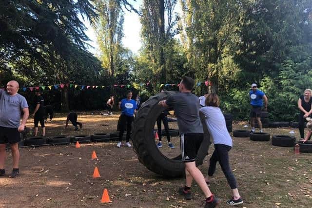 People take part in the boot camp.