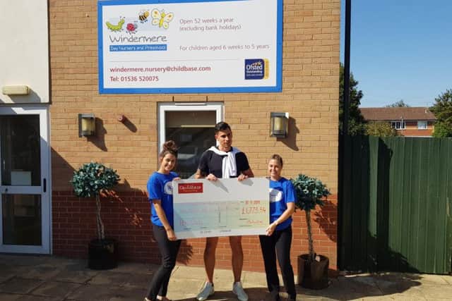 Staff with the fundraising cheque.