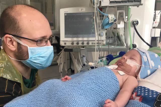 Baby Ned with his dad, Dan Rowe. Ned was on a ventilator for 12 days.