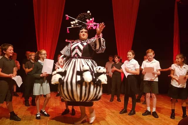 Children from Great Doddington primary school introduced the cast, including Robert Squire as Widow Twankey