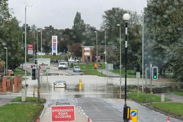 Oakley Road has been closed due to flooding, and it appears a car has got stuck in the water
