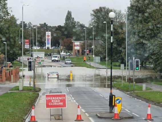 Oakley Road has been closed due to flooding, and it appears a car has got stuck in the water