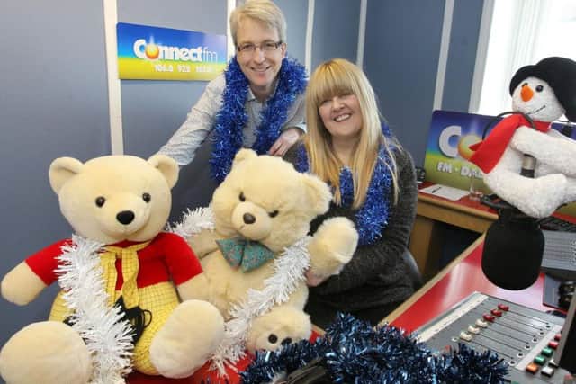 Liz Rhodes with Mark Jeeves pictured for Connect FM's toy appeal at Christmas in 2013