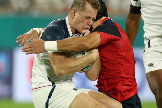 Piers Francis put in a hit on Will Hooley during the opening seven seconds of the game between England and the USA
