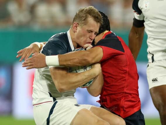 Piers Francis put in a hit on Will Hooley during the opening seven seconds of the game between England and the USA