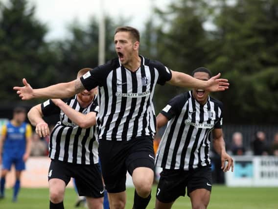 Charlie Wise shows his delight after he opened the scoring in Corby Town's 2-0 win over Biggleswade at Steel Park. Pictures by Alison Bagley