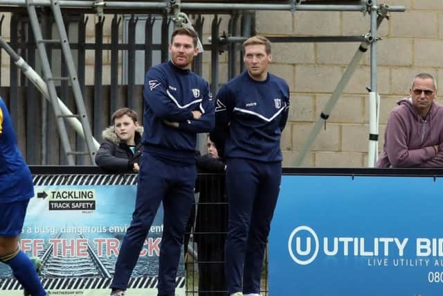 Joint-manager Ashley Robinson and assistant-boss Elliot Sandy watch on from the sidelines