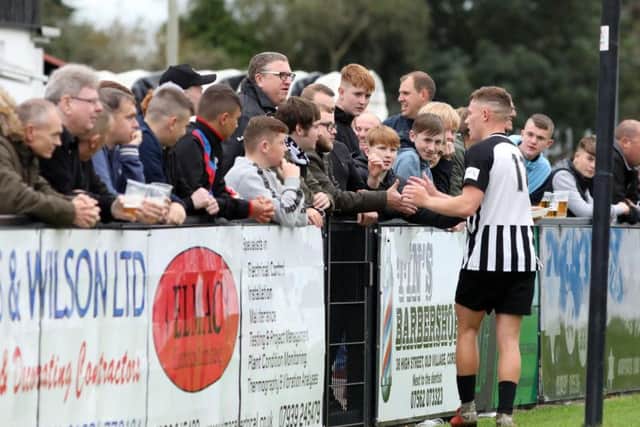 Jordon Crawford takes the plaudits from the Corby Town fans after the 2-0 win over Biggleswade