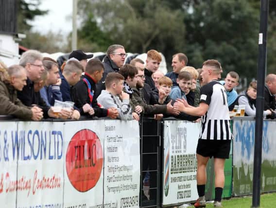 Jordon Crawford takes the plaudits from the Corby Town fans after the 2-0 win over Biggleswade