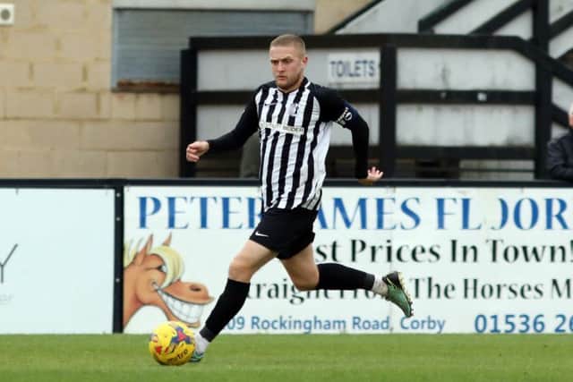 Steelmen captain Jake Duffy gets on the ball at Steel Park