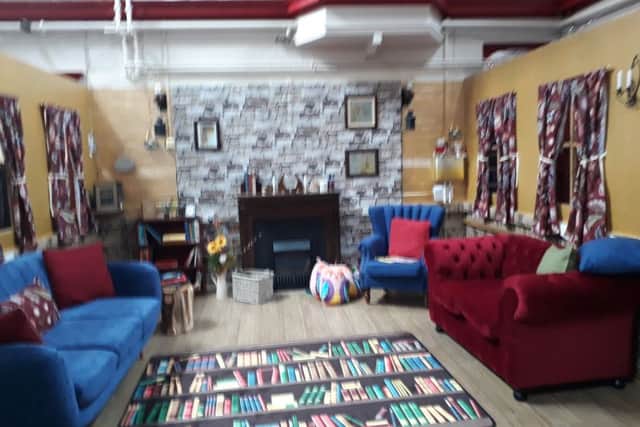 The Story Cottage is furnished with sofas, cushions and curtains