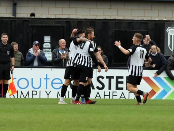 The Corby Town players celebrate Steve Diggin's goal during Saturday's 2-0 success over Biggleswade. Picture by Alison Bagley