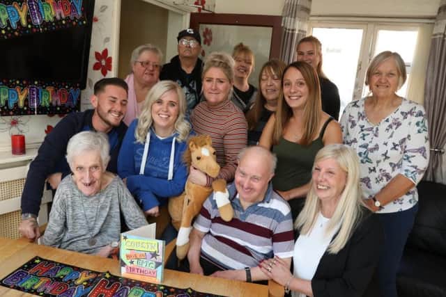 Robin with staff and residents at the residential home.