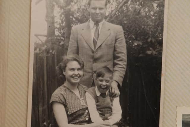 Robin with his parents.