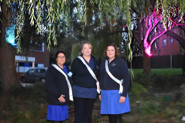 Stephanie Fretter, Bereavement Midwife, Kim Attley, Lead Midwife for Fetal Health and Labour Ward, and Carolyn Rowbotham, Bereavement Midwife, outside Rockingham Wing turning on the KGH lights