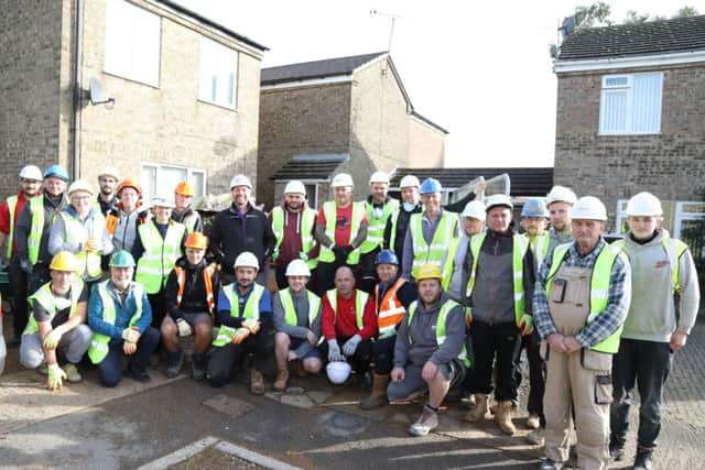 Presenter Nick Knowles with traders and volunteers at the Hutchison's home