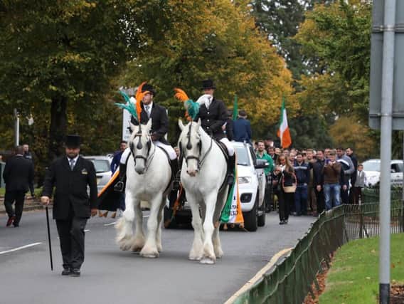 A large funeral procession walked through Kettering today from St Edward's church to Warren Hill crematorium