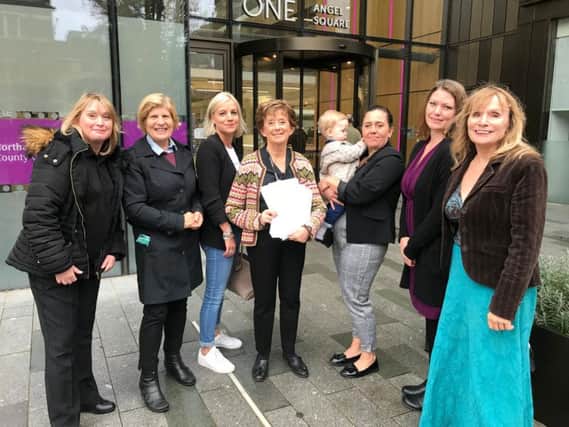 Candidate for Northampton North MP Sally Keeble, parents of the children at Northgate and Beehive and councilor for Delapre and Briar Hill Julie Davenport pictured handing over the petition today to cabinet member for children's services Fiona Baker.