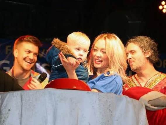 Dylan McCrystal won a competition to turn on the Christmas lights with the star of Wellingborough's panto, Atomic Kitten singer Natasha Hamilton