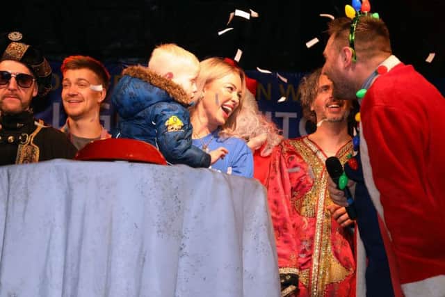 Confetti and cheers to celebrate the Christmas lights being turned on!