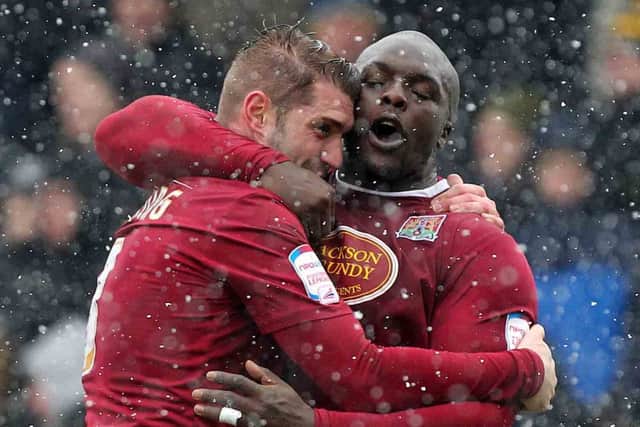 GOAL-DEN GUY - Ben Harding is congratulated by Adebayo Akinfenwa after scoring the only goal of the game at Sixfields (Picture: Sharon Lucey)