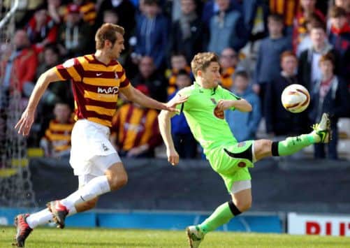 Jake Robinson attempts to control the ball during the Cobblers' clash at Bradford City (pictures: Kirsty Edmonds)