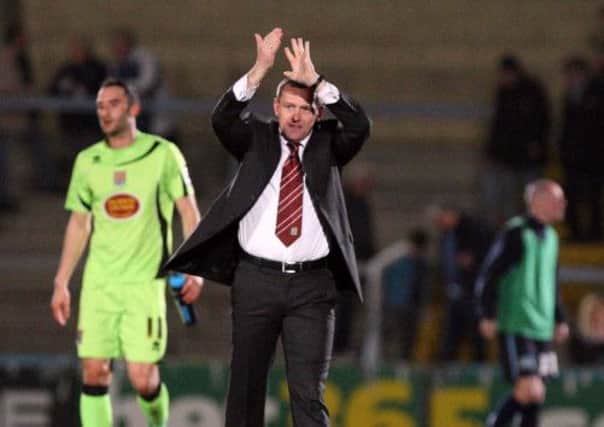 MASSIVE THANKS - Cobblers boss Aidy Boothroyd acknowledges the support of the travelling Town fans ay Wycombe last night (Pictures: Kelly Cooper)