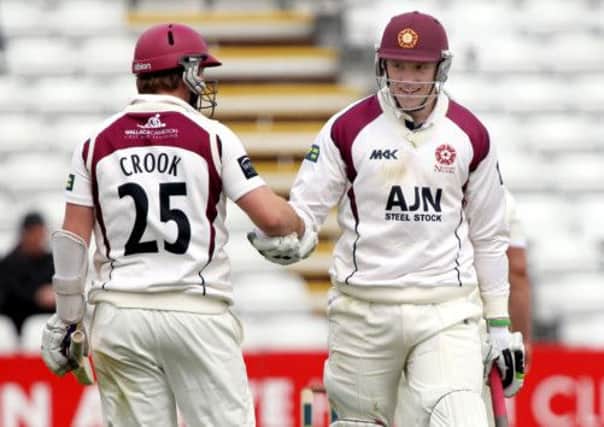 IN THE RUNS - David Willey (right) and Steven Crook enjoy another boundary during their partnership at the County Ground (Pictures: Kirsty Edmonds)