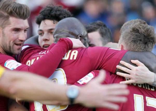 ROY'S THE BOY - Cobblers celebrate Roy O'Donovan's opener against Barnet (pictures: Kirsty Edmonds)