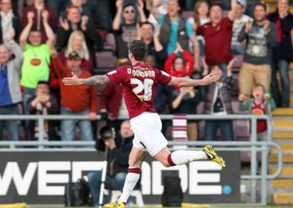 CLASSY STRIKE - Roy O'Donovan celebrates after putting the Cobblers ahead against Cheltenham (pictures: Kirsty Edmonds)