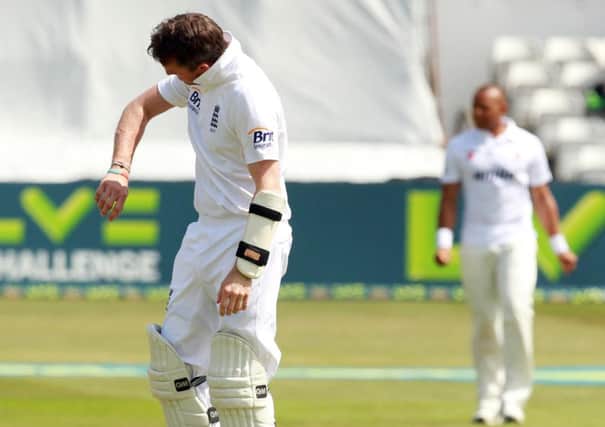 THAT HURT - Graeme Swann inspects the damage after he was hit on the arm by Essex fast bowler Tymal Mills