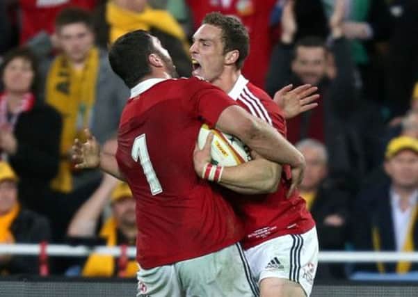 SAINTSMEN - Alex Corbisiero celebrates with George North after the Wales wing scores for the Lions