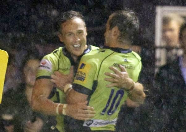 WELL DONE - Stephen Myler congratulates James Wilson after his match-winning try at Harlequins (picture: Linda Dawson)