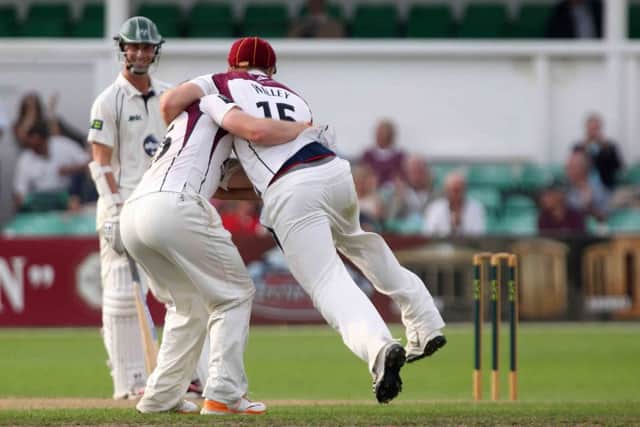 David Willey and Steven Crook celebrate after news of the County's promotion to Division One was confirmed