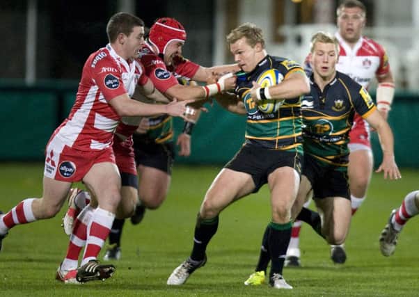 HOLDING FIRM - Tom Stephenson holds off Gloucester as the Wanderers impess on their way to the 'A' League final (Picture: Linda Dawson)
