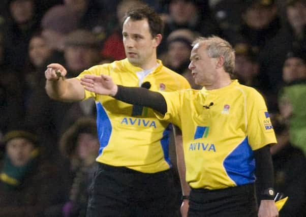 TAKING HIS TIME - referee Greg Garner (left) frustrated both bosses with his use of the TMO (Picture: Linda Dawson)